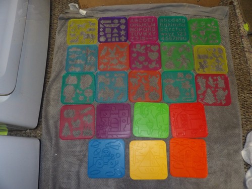 Tupperware stencils rubbing - &,